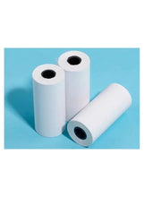 Thermal barcode label rolls with one roll unrolled on a surface