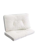 Quilted latex pillow with cutout design and gray-edged side panels, white cover.