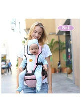 Baby hip seat carrier on adult, pink padded seat with shoulder straps