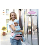 Baby hip seat carrier on adult holding baby, pink padded seat and straps