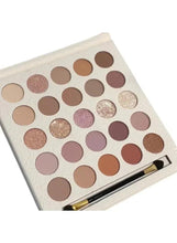 Cream eyeshadow palette with 25 pressed pans and gold-handled brush, open