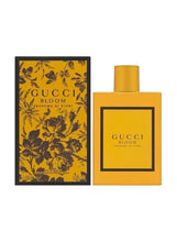 Gucci Bloom eau de parfum bottle with floral box and gold label