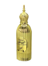 Gold ribbed eau de parfum bottle with ornate cap, front label with Arabic text