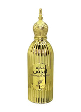Gold ribbed eau de parfum bottle with ornate cap, label and crest emblem visible
