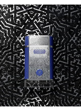 Eau de parfum bottle with silver labyrinth pattern, blue label, and dark cap