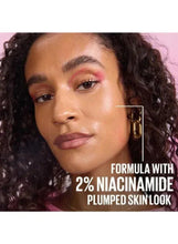 Model wearing serum primer look; face close-up with 2% niacinamide text