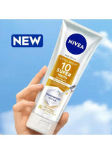 NIVEA body serum tube held in hand, white with blue logo and yellow 10 super youth