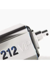Silver fragrance bottle close-up, '212 VIP' text on brushed metal