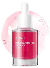 Anua niacinamide serum bottle with white dropper; clear glass with red liquid