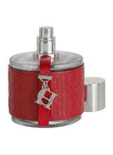 Red perfume bottle with silver cap and visible spray mechanism, with CH charm