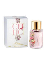 Perfume bottle set with pink glass bottle and gold cap, shown with white printed box