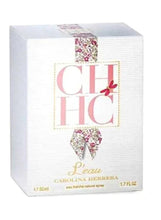 Perfume carton with CH logo, pink ribbon bow graphic, and 50 ml text