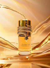 Gold perfume bottle with textured ribbon cap, close-up view of bottle front