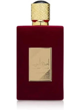 Red Eau de Parfum bottle with gold textured cap and gold-framed label