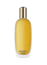 Amber perfume spray bottle with metallic cap labeled AROMATICS ELIXIR