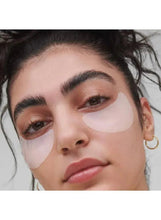 Under-eye gel mask pads on cheeks and around eyes