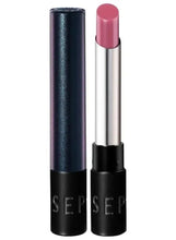 Soft pink glossy lipstick in silver tube with black cap and base