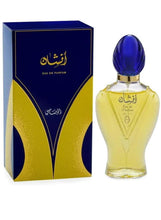 Eau de parfum bottle, blue cap and yellow glass, with blue-and-gold box