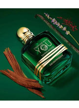 Sandalwood eau de parfum bottle with gold cap and wood stick accents