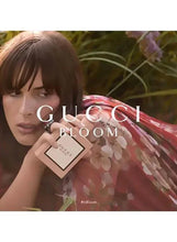 Gucci Bloom eau de parfum bottle with heart tag and pink cap