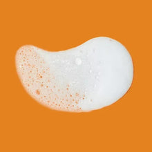 Foaming wash lather dollop, white bubbles on the skin surface
