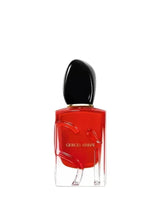 Red glass eau de parfum bottle with black cap and Giorgio Armani label
