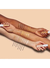 Beige hydrating camo concealer swatches on forearms with applicator tips