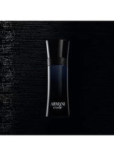 Armani Code eau de toilette bottle, cylindrical dark blue glass with black cap