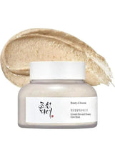 Ground rice and honey glow mask jar with beige cream smear on top