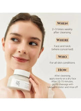 Ground rice and honey glow mask jar held near face for wash-off use
