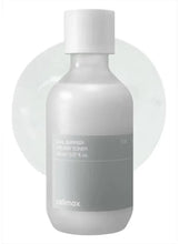 Creamy toner bottle with white pump and gray label, matte finish