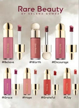 Soft Pinch liquid blush shade range display, including Worth and other rose tones
