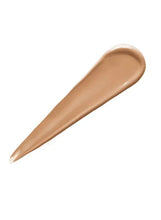 Warm beige liquid foundation swatch on applicator tip