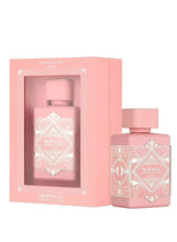 Blush pink Eau de Parfum bottle with ornate geometric label and matching gift box