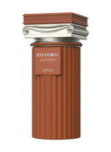 Extrait de parfum bottle, ribbed dark brown body with silver cap and Historic Sahara label