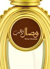 Gold perfume bottle label reading 'Wisal Dhahab' on brown oval medallion