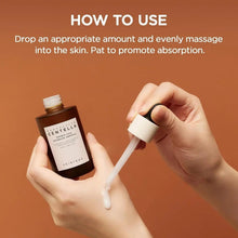 Hands holding a dropper dispensing white serum from an ampoule bottle