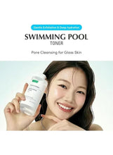 Person holding EQQUALBERRY Swimming Pool face toner bottle near face