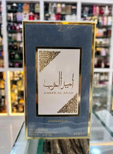 Blue perfume box with gold frame and white label