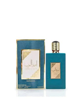 Blue eau de parfum bottle with gold cap and matching box
