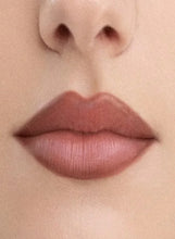 Everyday pink lip liner swatched on lips, outlining the mouth.