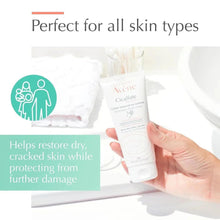 Avène Cicalfate restorative hand cream tube held in a hand.