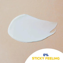 White sunscreen gel swatch on skin, with label 0% sticky feeling