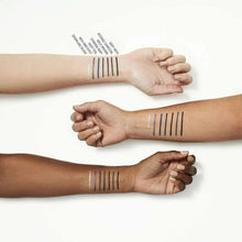 Arm swatches of eyeliner pencil in multiple straight lines on wrist and forearm