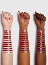 Glossy lipstick swatches on forearms, light to dark brown-red tones