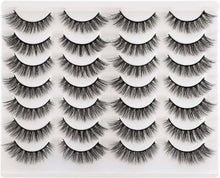 Wispy false eyelashes set with multiple cat-eye style lash pairs on tray