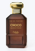 Brown eau de parfum bottle with gold cap, textured front panel and gold label