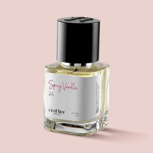 Spray perfume bottle with black cap and clear golden liquid, labeled Spray Vanilla