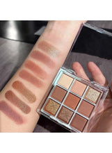 Warm-toned eyeshadow palette swatches on skin; matte and sparkle brown shades