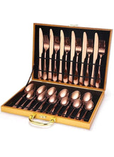 Rose gold stainless steel cutlery set with spoons, forks, and knives in open case
